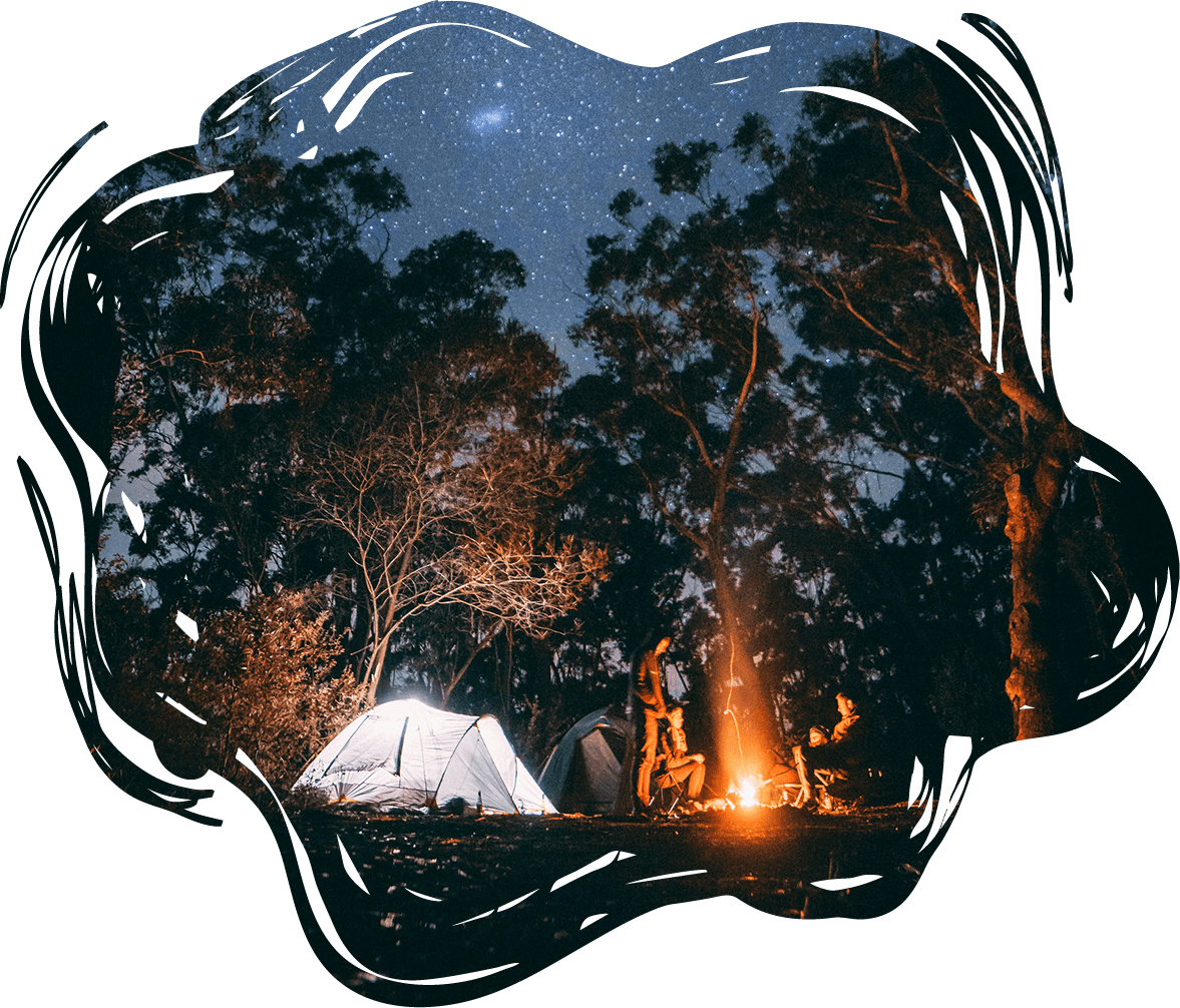 A group of people camping around a campfire